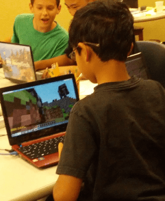 Student working on Minecraft at camp