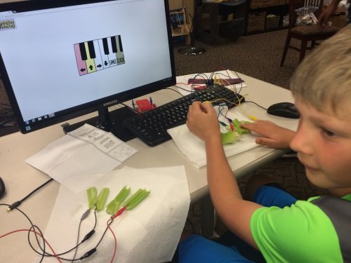 Engineering Camp - Student working on an electronic circuit