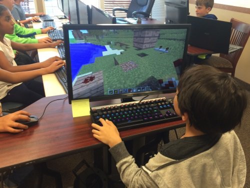 Students working on redstone projects at minecraft camp
