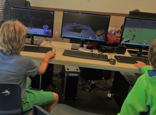Minecraft coding camp - students working at Minecraft camp