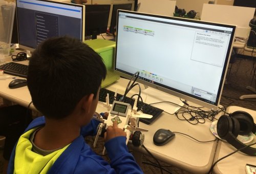 Programming camp - student programming their robot