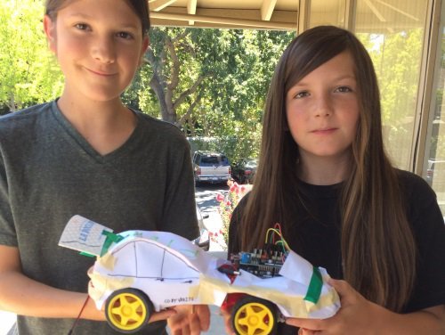 Robotics Camp - Students holding their robot