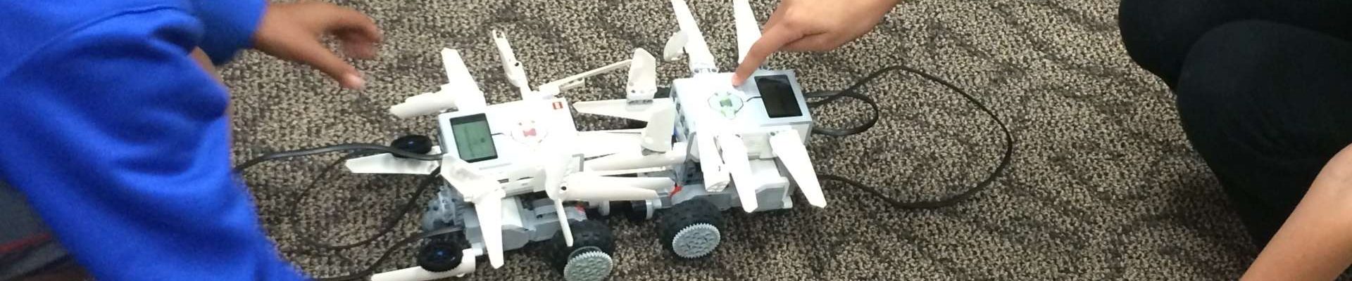 Two robots fighting during EV3 LEGO Robotics Camp.